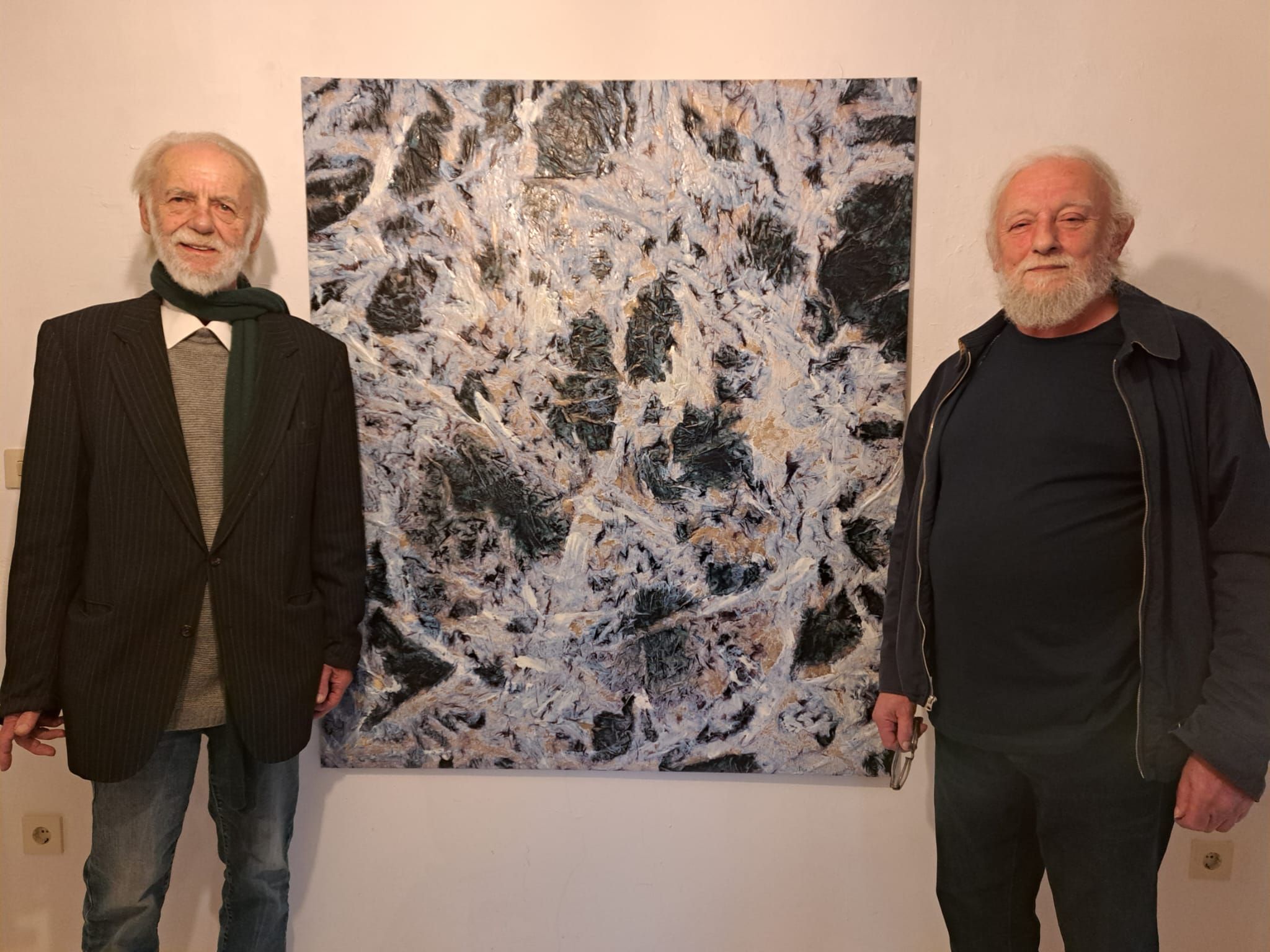 Alfons Roeckl links und Rudolf Wolfbeisser rechts, dazwischen ein Bild in schwarz und weiss