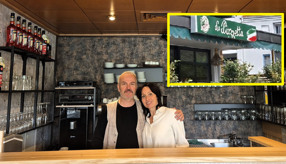 pizala Saverio La Becca mit seiner Frau Petra im La Piazzetta. Foto: Rosi Raab. Einbeblockt Restaurant von außen.